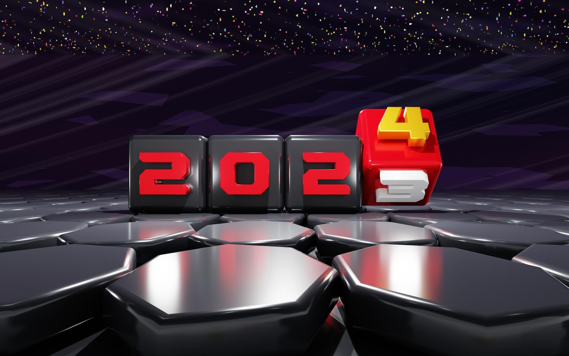 A futuristic scene features black glossy cubes displaying the number 2023, with the last cube rotating to reveal the number 2024.
