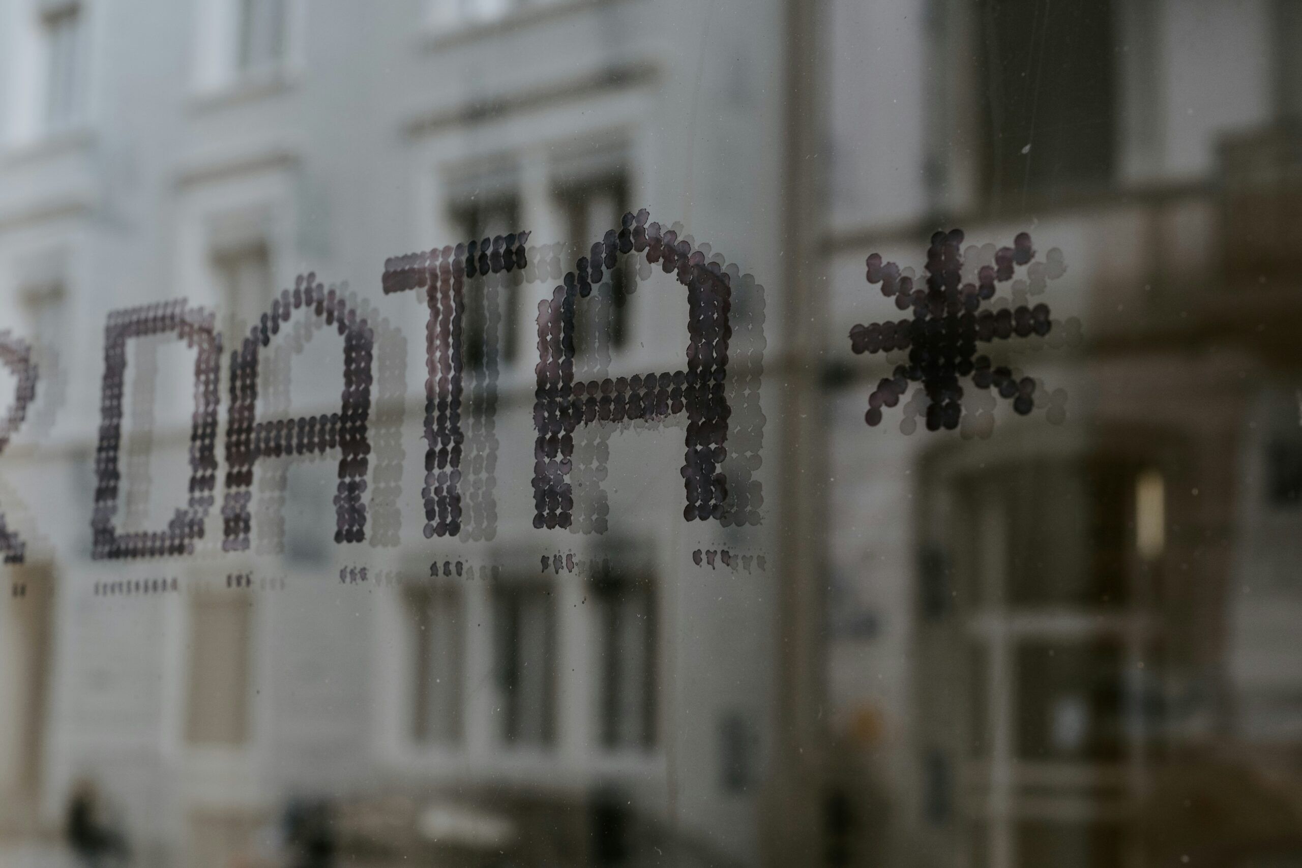 Photo of Data written on window with dots